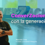 En la imagen se ve a Marcelo Cima, presidente y fundador de IT Patagonia mirando al frente con mirada amigable y sonriendo. Tiene los brazos cruzados. En el fondo se visualiza el logo del programa "Converzaciones" que significa conversaciones con la generación z. Sobre la imagen se lee: Converzaciones con la generación z.